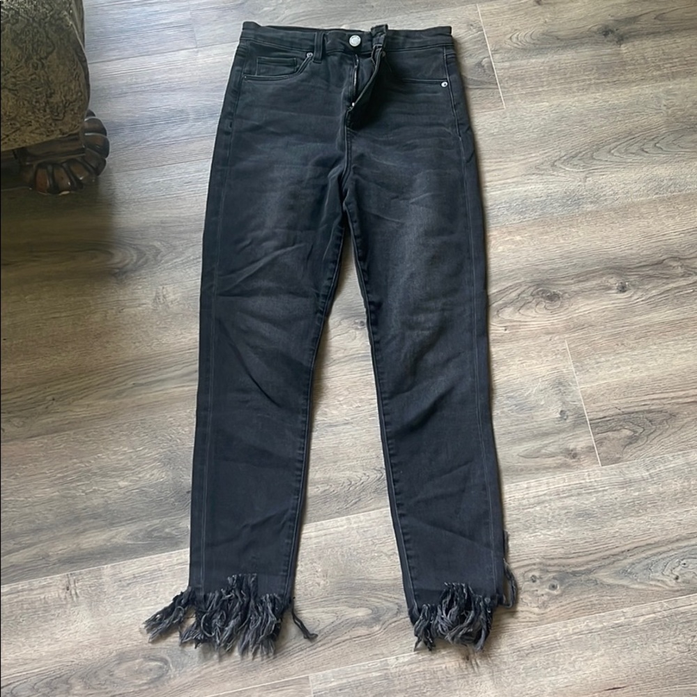 Black denim jeans with fringe on bottom